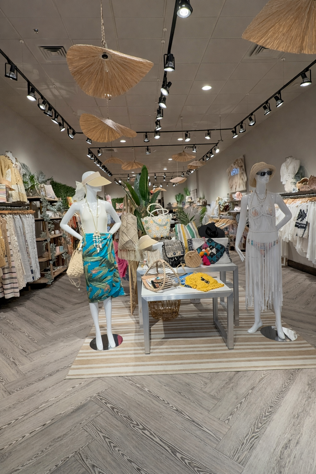 showcasing Mannequins in Vetu store setting with clothing and accessories on display.